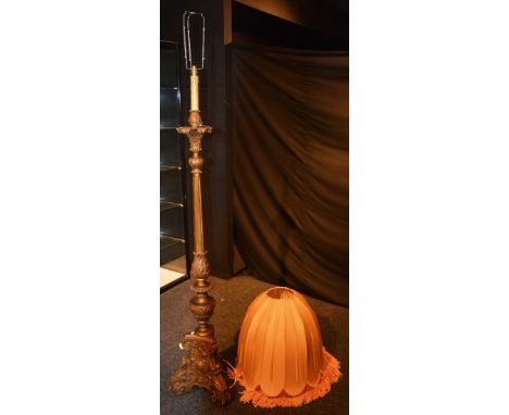 A gilt painted floor lamp with shade, 173cm high