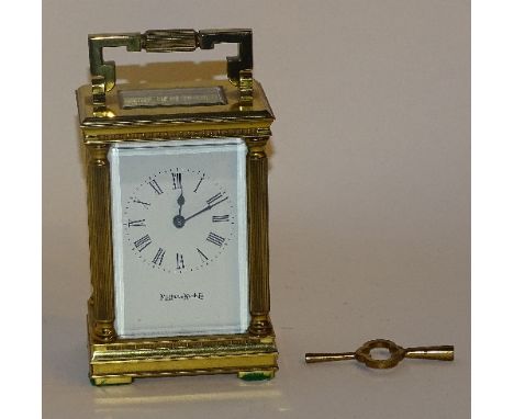 A Mappin & Webb carriage clock, the white enamel dial with Roman numerals, marked Mappin & Webb Ltd to face, carry handle to 