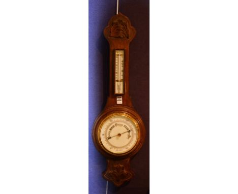 An oak wall barometer, with thermometer gauge above dial, 80cm high