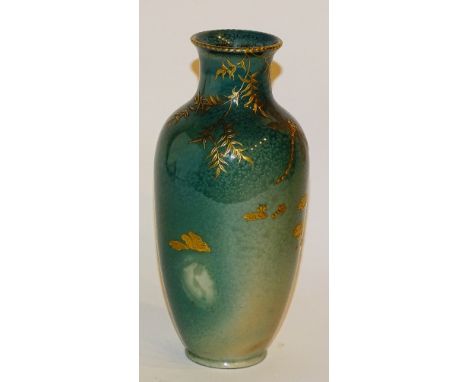 A Royal Doulton 'Titanium' vase, decorated with gold leaf style insects and lilipads, with leaf foliage on green ground, stam