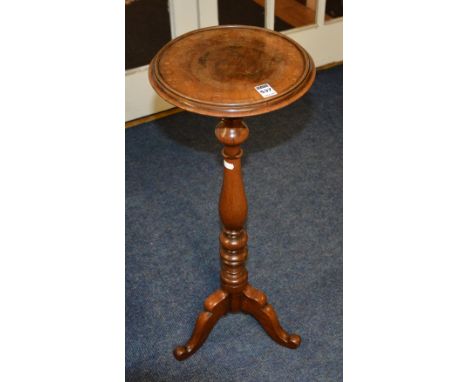 A 19th century turned mahogany wine table, with circular top, raised on tripod base, 70cm high x 28cm wide