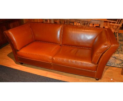 A contemporary tan leather two seater sofa, 80cm high x 205cm wide