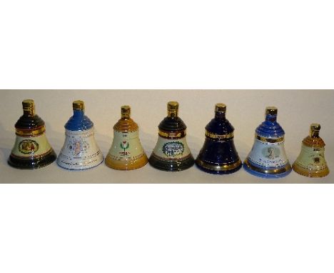 Seven Wade Bell's whisky decanters with contents, comprising of Christmas 1988, Christmas 1989, tubed, 100th Birthday of Quee