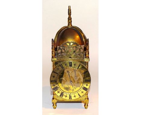 An 18th century style brass lantern clock case, with pierced fret above circular dial, 29cm high