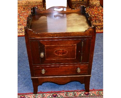 A 19th century mahogany commode cabinet, with tray gallery top above panelled door and drawer, 68cm high x 53cm wide x 51cm d