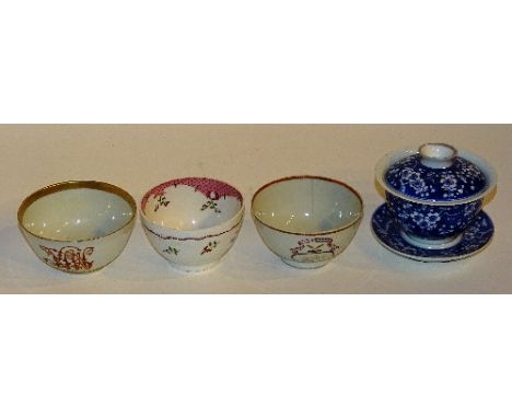 Three 19th century Chinese tea bowls, all bearing enamel decoration, 9cm diameter, together with a blue and white tea bowl wi