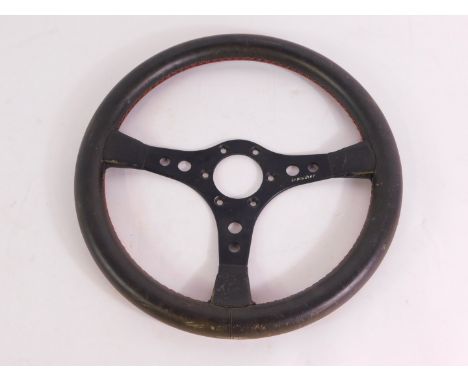 An Irmscher Opal / Vauxhall three spoke steering wheel, leather bound, serial no E1 / 0270503, 35.5cm diameter.