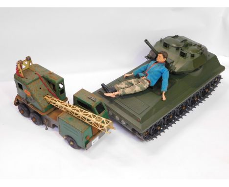 A Louis Marx &amp; Company tin plate Lumar Contractors Crane, 41cm wide, together with an Action Man Alvis Scorpion Tank, box