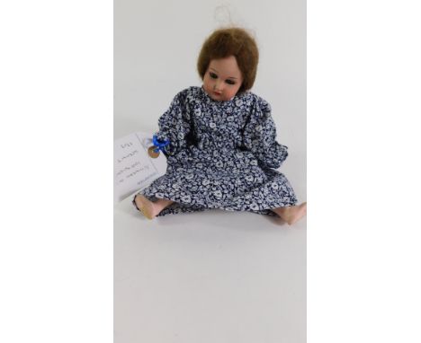 A Schoneau &amp; Hoffmeister small bisque head doll, 1909, 10/0, 26cm high.