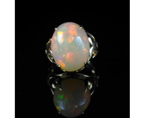 16.30ct Opal and 14ct yellow gold ring cabochon semi translucent crystal, displaying moderate green/ blue/ orange colour flas