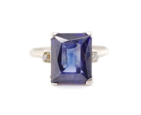 Blue spinel and diamond set 18ct white gold ring marked 18ct. Approx weight 4 grams, ring size L, *shank is off round, some w