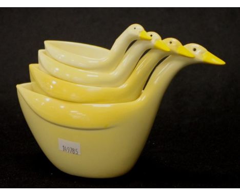 Set four early plastic Swan shape measuring cups capacity from quarter cup, to 1 cup.