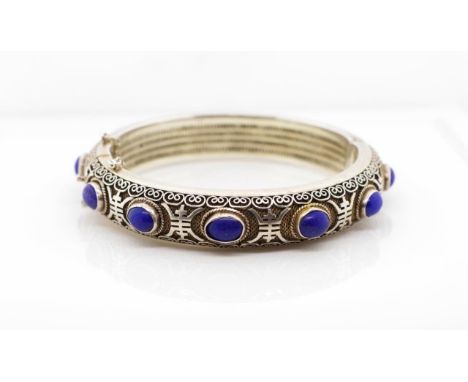 Vintage oriental silver and lapis bangle with fine filigree and applied oriental seals. Marked Silver With hinge, clasp and s