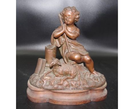 Vintage bronzed Child with Sheep figure seated child with resting sheep to foot, on carved wood base, (height 28cm approx).