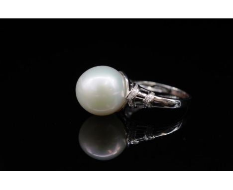 South sea pearl and 18ct white gold ring pave set with diamond shoulders. Marked AU 750. Approx pearl size 12.5mm, weight 5.5