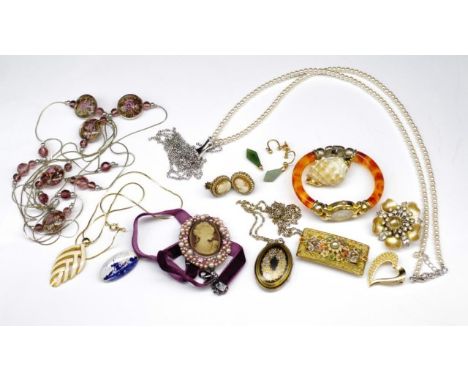 Costume jewellery group includes: an enamel locket marked Michele Frey, cameo pendant, carved cameo ear clips, two flower bro