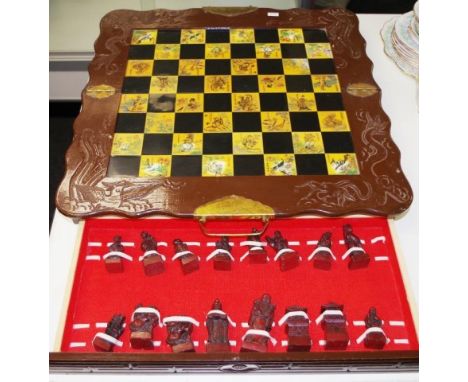 Chinese chess board with pieces ceramic inset chess board, with pieces in two drawers.