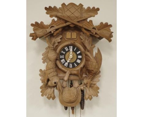 German Betriebsanleitung cuckoo clock with weight driven movement, 36cm high approx