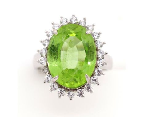 Peridot and silver halo ring approx peridot size 14.5mm x 11mm, ring size N adjustable