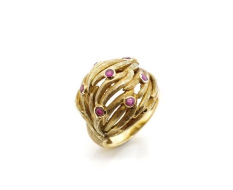 Ruby and 18ct yellow gold ring with a textured a weave body and bezel set round cut rubies. Marked 750 Italy. Approx weight 1