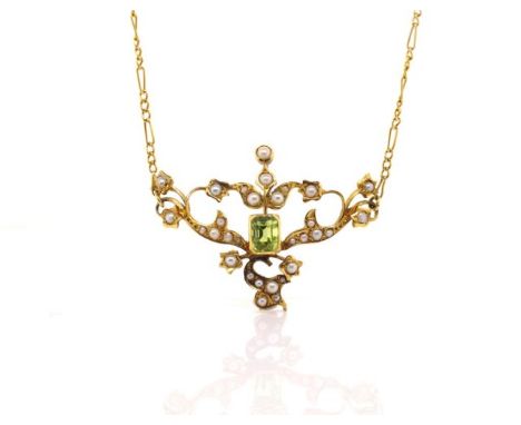 Victorian 15ct yellow gold pendant set with step cut peridot, seed pearls on a figaro chain with a barrel clasp. Marked 15ct 