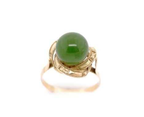 Oriental gold and dark green jade ring rubbed marked. Approx weight 2.6 grams, ring size M-N. tests as 12ct