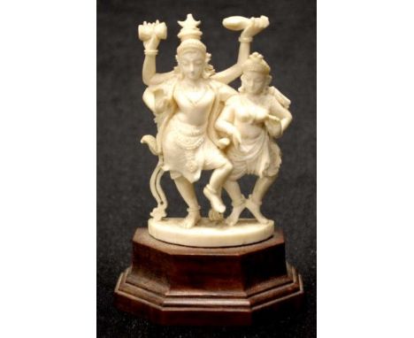 Vintage carved ivory Indian deity group on a timber base, height 10.5cm approx.NB This item cannot be exported.