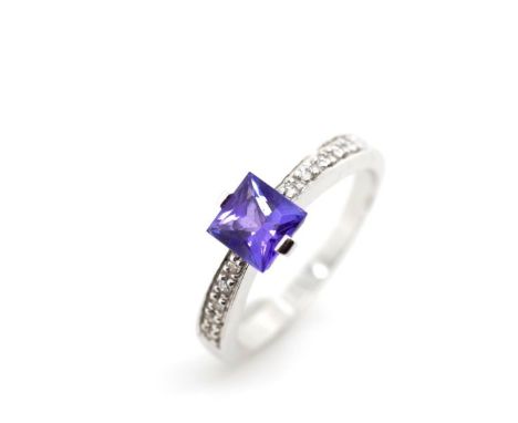 Tanzanite and diamond set 18ct white gold ring marked 18k. Approx weight  3.9 grams, ring size N-O