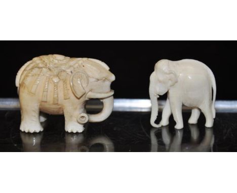 Two early carved ivory Elephant figures circa 1930, height 3.5cm approx. NB. This item cannot be exported.