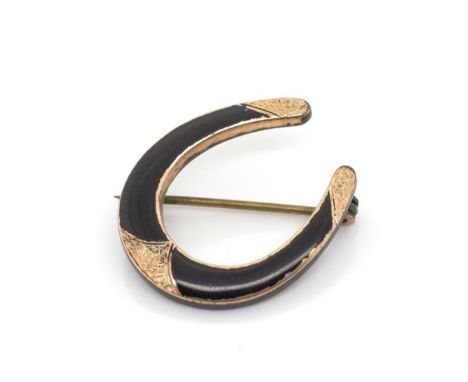 Antique enamel and gilt metal horse shoe brooch unmarked. Approx width 22mm