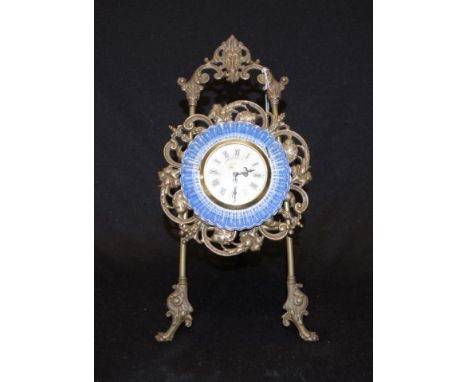 Japanese brass &amp; porcelain desk clock on a decorative brass easel, height 20cm approx. Replaced battery movement.