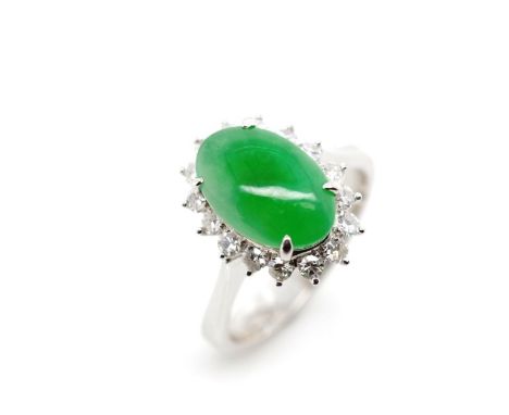 Jade and diamond set 14ct white gold cluster ring marked 585. Approx states 1x jade cabochon 11mm x 7.3mm x 3.77mm depth, med