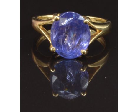 An 18ct gold ring set with an oval cut tanzanite, size K, 4.7g&nbsp;