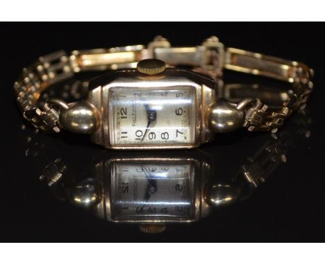 Rotary 9ct gold ladies wristwatch with blued hands, black Arabic numerals, silver dial and signed 15 jewel calibre 790 moveme