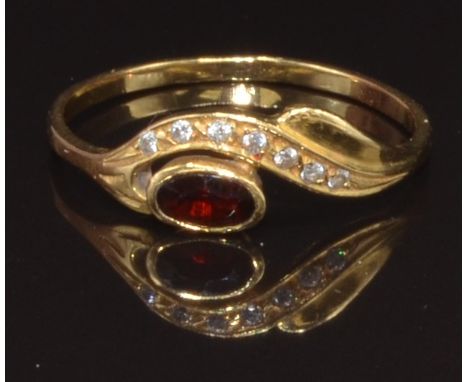 A yellow metal ring set with a garnet and cubic zirconia, marked 800, size R, 1.9g
