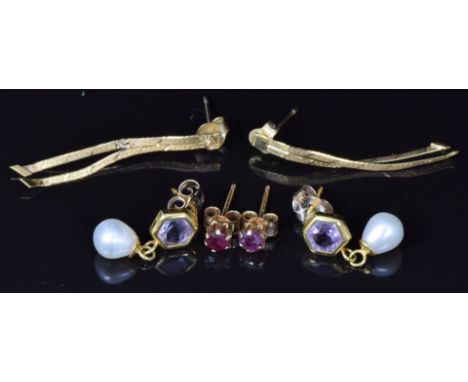 Three pairs of 9ct gold earrings, one pair set with a ruby and the other a pearl and amethyst, 1.8g&nbsp;