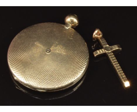A yellow metal engine turned locket and a 9ct gold cross, 8.4g