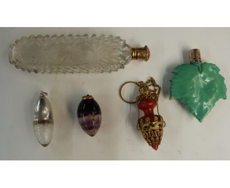 Scent bottles comprising cut glass example with gilt metal lid, length 11.5cm, egg shaped example, ceramic example formed as 