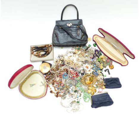 A collection of jewellery including beaded, amethyst&nbsp; and pearl necklaces, vintage brooches, Asprey bag, etc&nbsp;