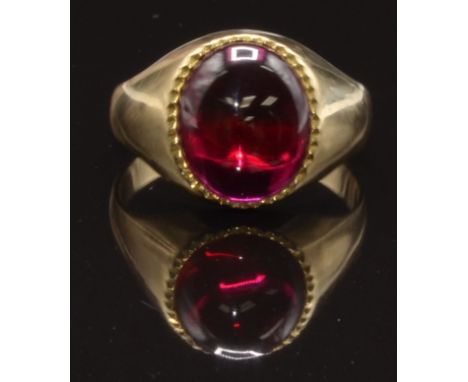 A 9ct gold ring set with a synthetic ruby cabochon, size N, 4.4g