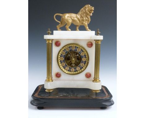 French 19thC&nbsp;mantel clock in onyx case supported by gilt brass reeded columns surmounted by standing lion, the dial with