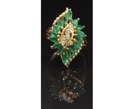 A 14k gold ring set with three marquise cut diamonds and 16 marquise cut emeralds, size P, 6g