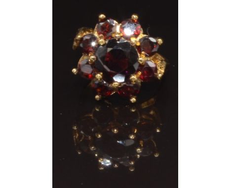 A 9ct gold ring set with a cluster of garnets, size L, 4.7g