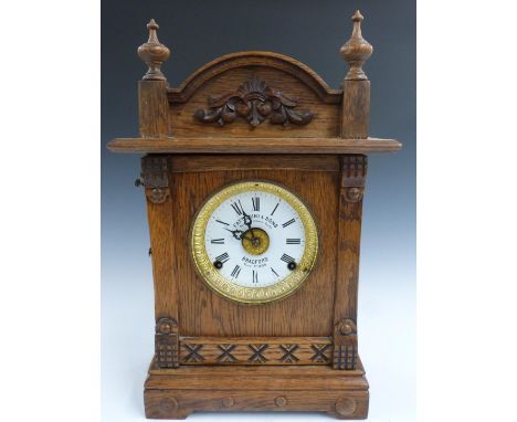 Oak cased shelf / mantel clock, Fattorini &amp; Sons, Bradford to enamel Roman dial, the movement incorporating alarm facilit