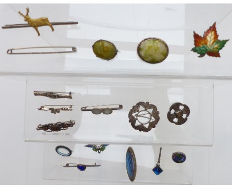 A collection of silver brooches including enamel set, thistle, Robert Allison, butterfly wing, Victorian with gold applied de