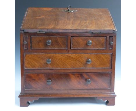 19thC mahogany miniature apprentice / salesman's sample bureau with two over two graduated drawers, fall flap with faux lock,