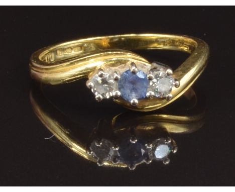 A 9ct gold ring set with a round cut sapphire and two diamonds, size M, 3.7g