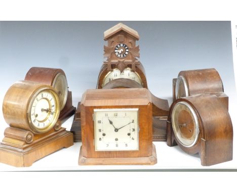 Six C1920-1930 mantel clocks and a 1970s cuckoo wall clock, includes a drum cased Wurttemberg example&nbsp;