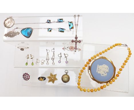 A collection of jewellery including vintage earrings, Victorian silver brooch, silver compact, amber necklace, Stratton Wedgw