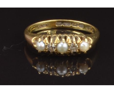 An 18ct gold ring set with diamonds and pearls, Birmingham 1914, size M, 3.3g
